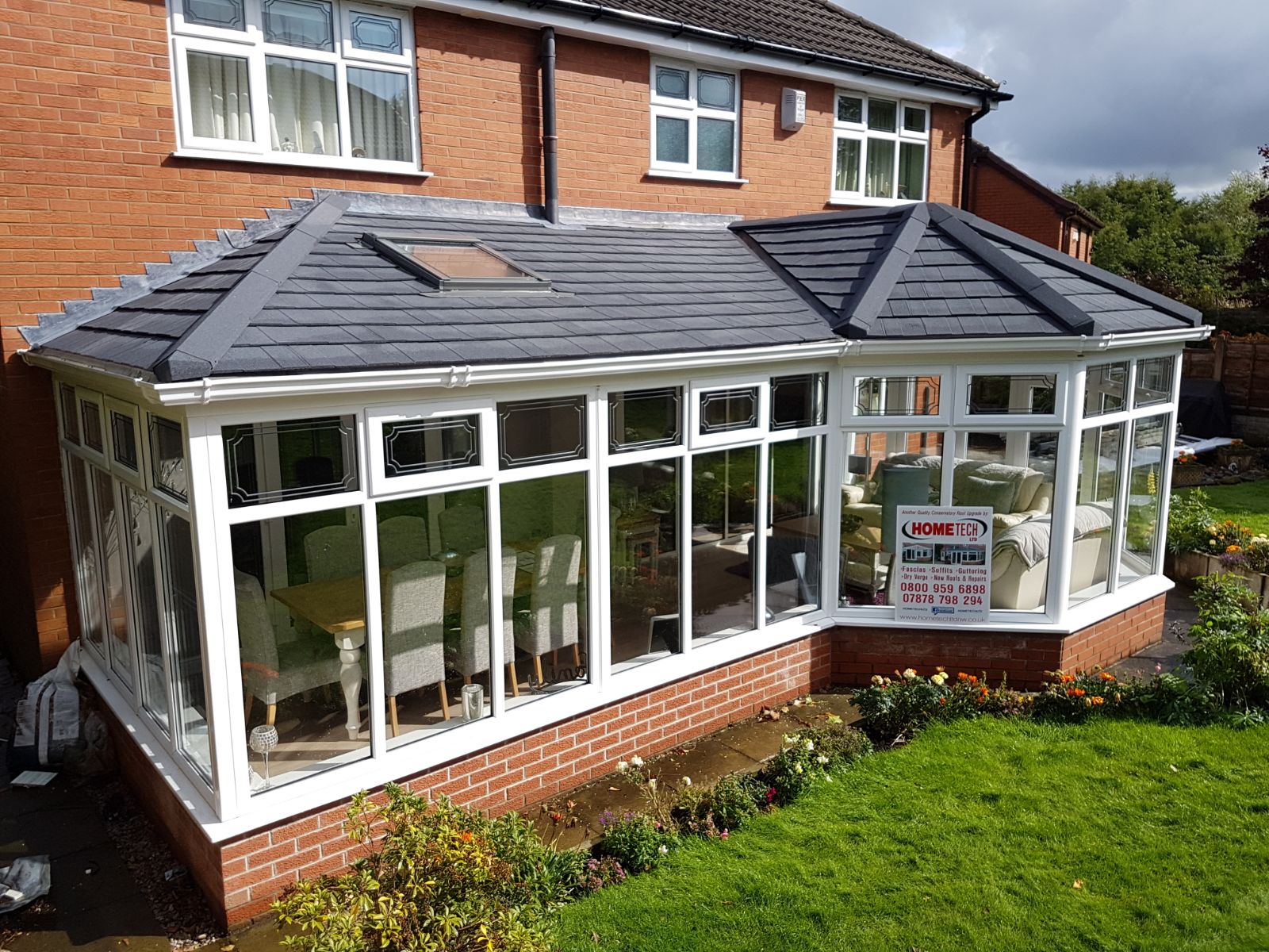 image showing conservatory with advertisement to contact a roofer in sheffield